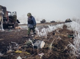 Эксгумированное из братской могилы под Дебальцево тело бойца ВСУ передадут Киеву