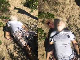 На пляже столичной Троещины нашли труп с пулей в голове
