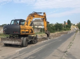 В Мелитополе дороги частного сектора закатывают в асфальт (фото, видео)