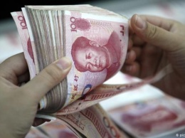 Курс юаня к доллару упал до самой низкой отметки за 11 лет