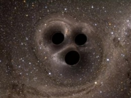 Астрономы обнаружили тройную сверхмассивную черную дыру