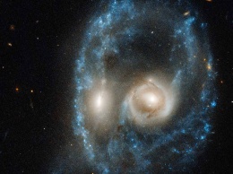 НАСА продемонстрировала уникальный снимок столкнувшихся галактик
