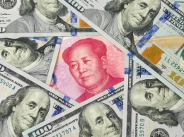 Китайский юань укрепляется по отношению к доллару на фоне потепления в торговой войне - FT