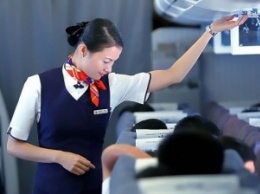 В Китае пассажирка задержала рейс, перепутав туалет с запасным выходом