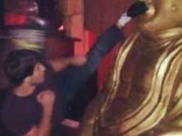 Российский борец в Калмыкии помочился в храме и ударил в нос статую Будды