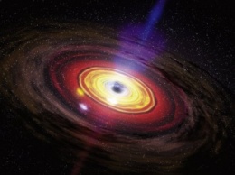 Ученым удалось зафиксировать радиосигнал в крупной черной дыре