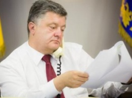 П.Порошенко призвали запретить партию "Единая Россия" в Украине