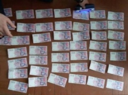 Госисполнителя в Ровенской области поймали на взятке в 10 тысяч гривен