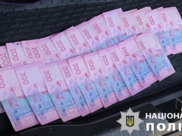 На Днепропетровщине полиция задержала на взятке двух должностных лиц городских советов