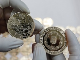 В Украине продали на аукционе 9 золотых памятных монет за 1,4 млн гривен. Фото