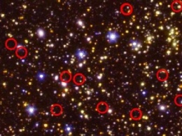 Телескопа NASA Spitzer обнаружил необычные галактики времен ранней Вселенной