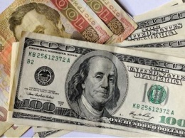 Доллар "прокатился" на американских горках: что будет с курсом на следующей неделе