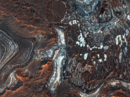 Опубликован снимок системы каньонов на Марсе
