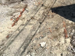 В центре Днепра ливень обнажил старинный тротуар (ФОТО)