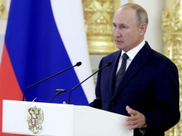 Путин подписал закон о повышении налога на "богатых"