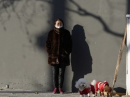 В Китае жителей двух городов просят не выходить на улицы из-за локальной вспышки Covid-19