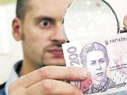 Фальшивые деньги заполонили Украину: где могут подсунуть и как узнать подделку