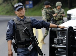 В Мексике банда боевиков зверски расправилась с полицией (фото)
