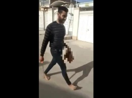 В Иране муж отрезал жене голову на площади