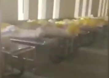 Длинный ряд трупов в мешках: появились жуткие кадры из крематория в Ухане, где свирепствует коронавирус (видео)