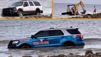 В США утопили два внедорожника и трактор, пытаясь достать из воды полицейскую машину