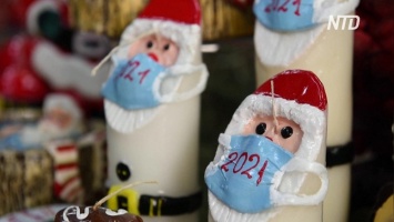Свечи с изюминкой: в Греции Санта-Клауса нарядили в маску (видео)