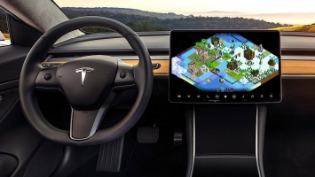 Владельцы Tesla смогут играть в The Battle of Polytopia, Cat Quest и Пасьянс прямо в машине